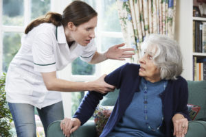 Care worker mistreating senior woman in her home
